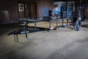 Image of a Trailers by Premier 6x14 Straight Deck Utility Trailer with a single axle and a 4ft ramp.