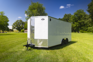 Image of a Trailers by Premier 8.5x16 Enclosed Trailer with dual axles, ramp door, and side entry door.
